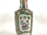 a vase that is sitting on a white surface