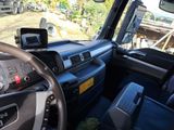 a view of the inside of a truck from the driver ' s seat