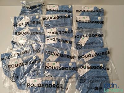 a lot of blue socks that are wrapped in plastic