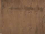 an old brown piece of paper with writing on it sitting on top of a table
