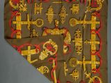 an image of a scarf with gold and red designs on it