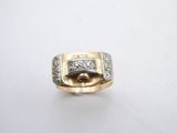 a close up of a gold ring with diamonds on a white background