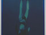 an image of a framed photograph of a person swimming in the ocean