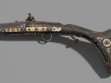 an old gun that is on display in a museum