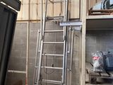 a ladder that is next to a window in a room