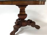 a close up of a table with a marble top on a white background