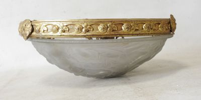 an image of a silver bowl with gold decoration on the rim