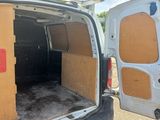 a white van with the door open in a parking lot