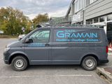 a van parked in a parking lot with a sign on the side of it