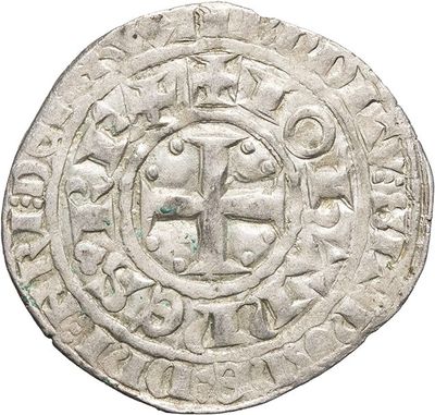 a silver coin with an image of a cross on it