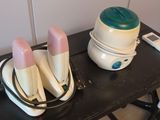 several toothbrushes are sitting in a bowl on a black table