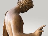 an image of a statue of a man holding a cell phone