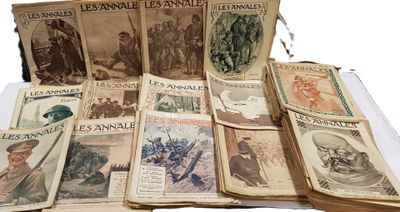 several old books are stacked on top of each other on a table