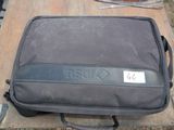 a suitcase sitting on a table with a price tag on it