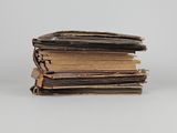 a stack of old books sitting on top of each other