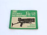 a close up of a book with a gun on it