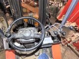 a forklift with a steering and a steering wheel on it
