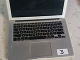 two laptops that are sitting on a table