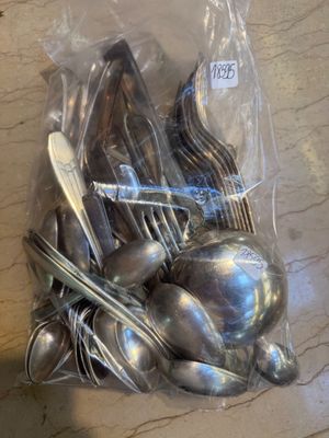 a bag of silverware sitting on a table