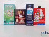 four boxes of playing cards sitting on a table