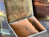 a small wooden box sitting on a glass table