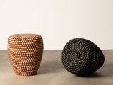 two black and brown vases sitting on top of a table