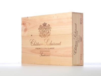 a wooden box that has a bottle of wine in it