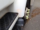 a close up of a truck ' s front tire with a flat tire