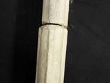 a close up of a stone pillar on a black background