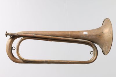 an old brass trumpet hanging from the ceiling