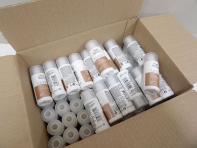 a cardboard box filled with lots of different types of paint