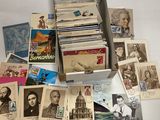 a box full of old postcards on a table