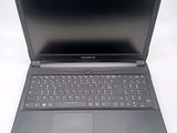 a black laptop with a keyboard on a white surface