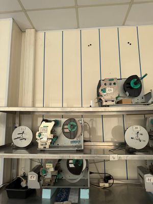 many different types of machines on the shelves in the room
