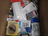 a cardboard box filled with electronics and other items