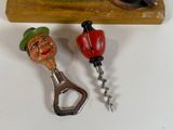 two bottle openers that are sitting next to each other