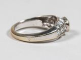 a close up of a diamond ring on a table