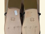 a picture of a pair of shoes with a tag on them
