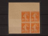 an orange stamp with a picture of a woman holding a tennis racquet