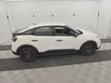 a picture of a white car parked in a garage