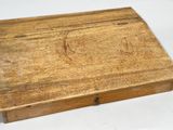 an old wooden box sitting on top of a white table