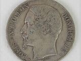 a close up of a coin on a white surface