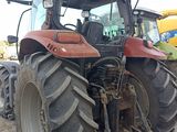 a tractor that is parked on the side of the road