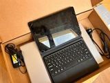 a laptop computer sitting in a box on the floor