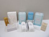 several boxes of different types of cosmetics on a white table
