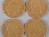 three british gold sovereigns, one of which is a sovereign, the other of which is a sovereign