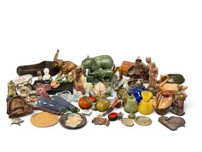 a pile of assorted figurines on a white surface