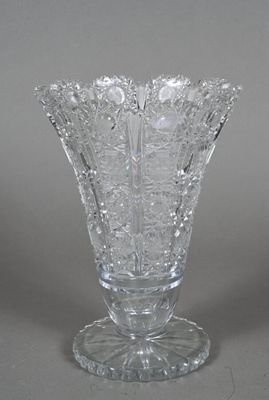 a glass vase that is sitting on a table