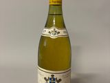 a bottle of wine that is sitting on a table