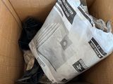 a cardboard box with a newspaper in it on the floor